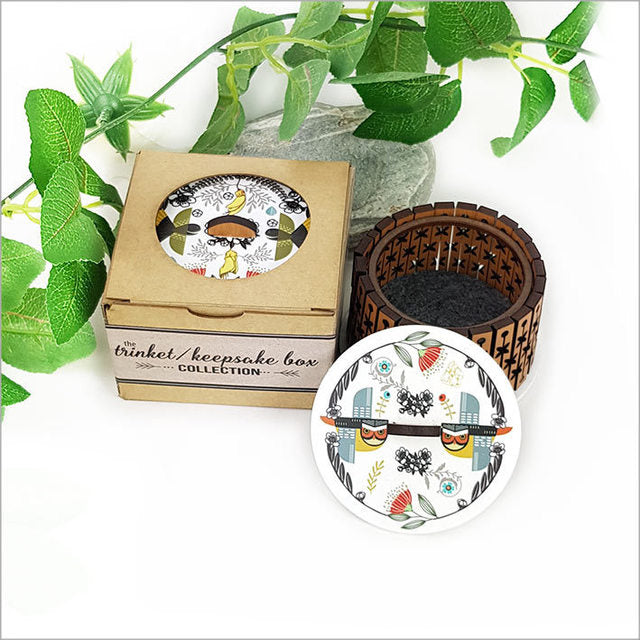 Round trinket box with NZ Rimu veneer and acrylic lid featuring intricate designs, ideal for storing jewelry and keepsakes.