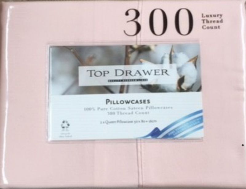 Blush queen pillowcases (50x80cm) in 300TC cotton, offering softness and elegance for a restful night's sleep.