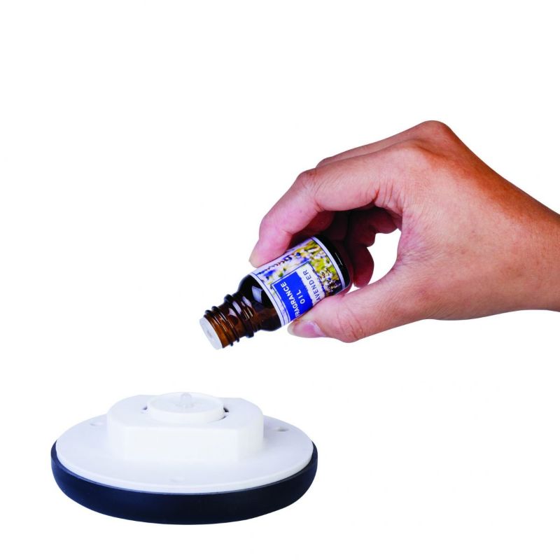 Compact Aroma Diffuser (10.7cm) with LED lights, Lavender Essential Oil, and 6 scent pads for relaxation and wellness.