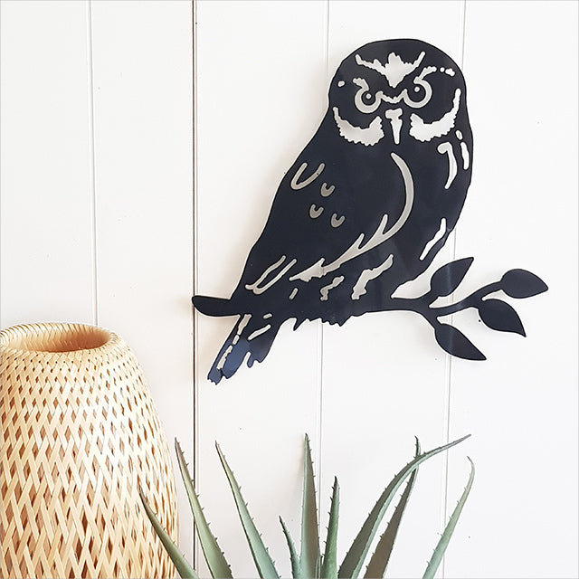 Elegant wall art featuring a Ruru bird on a branch, crafted from durable black ACM, perfect for any indoor or outdoor decor.
