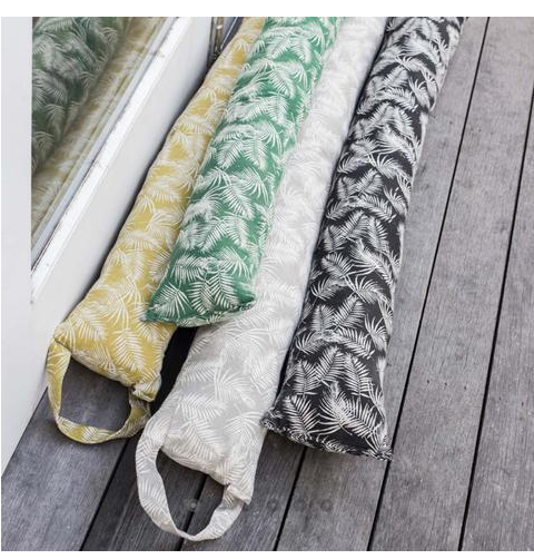 Cozy Palm Goat Draught Stopper in vibrant colors, designed to block drafts and enhance home decor during winter.