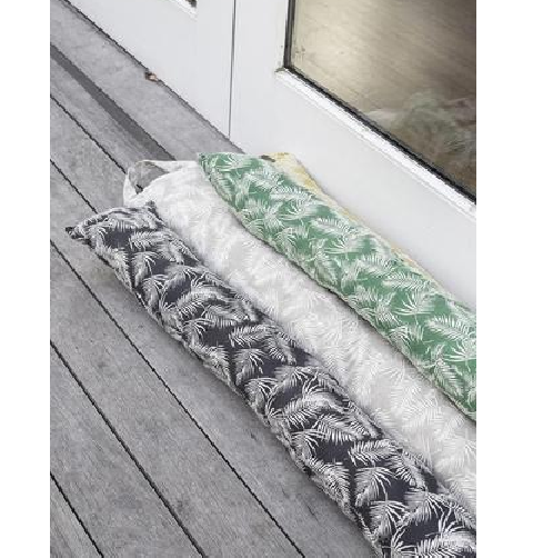 Cozy Palm Goat Draught Stopper in vibrant colors, elegantly blocks drafts while enhancing home decor.