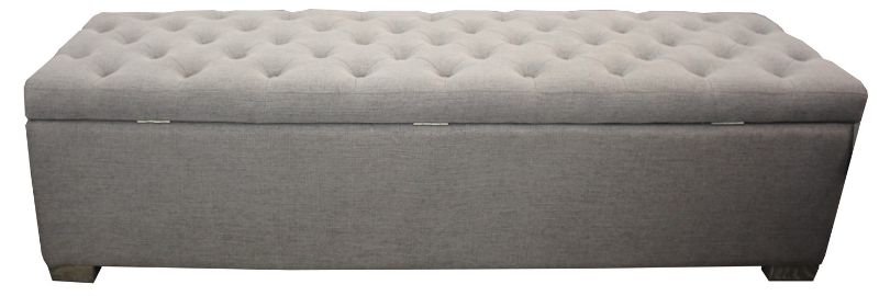Grey linen ottoman blanket box with metal handles, stylishly storing blankets while enhancing any bedroom decor.