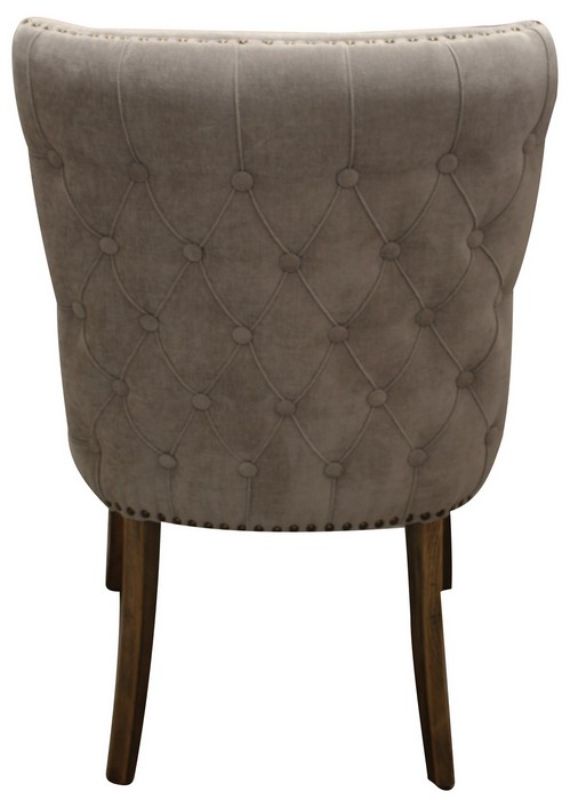Stylish grey linen dining chair with buttoned back, solid oak legs, and luxurious comfort for elegant dining spaces.