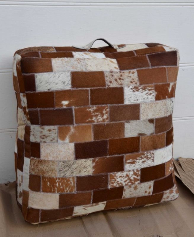 Luxurious Leather Goat Skin Puff Ottoman with unique patchwork design, perfect for footrest or extra seating in any decor.