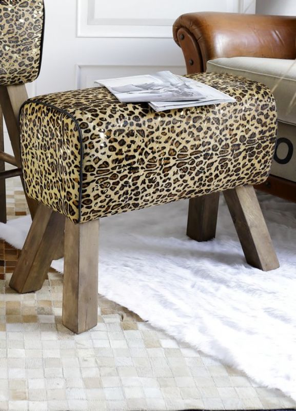 Leopard Leather Vault Stool featuring luxurious cowhide and a durable mango wood frame, ideal as a seat or accent piece.