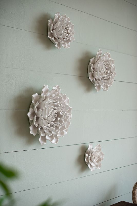 Handmade ceramic flower wall decor in cream, featuring textured petals, perfect for enhancing any modern or bohemian space.