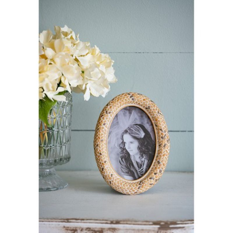 Vintage-inspired 4x6" oval photo frame in stone powder and resin with multi-color accents, featuring a protective glass front.