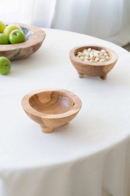 Elegant teak bowl with distinct grain, ideal for entryway or dresser as a decorative catch-all. Eco-friendly design with legs.