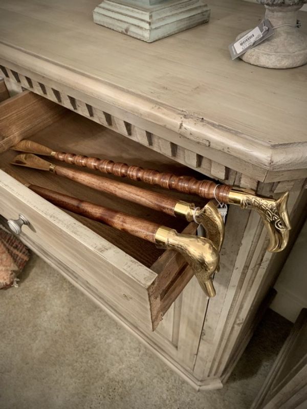 Elegant walnut finish shoe horn with brass accents, featuring a unique bird head design and measuring 55 cm for stylish shoe access.