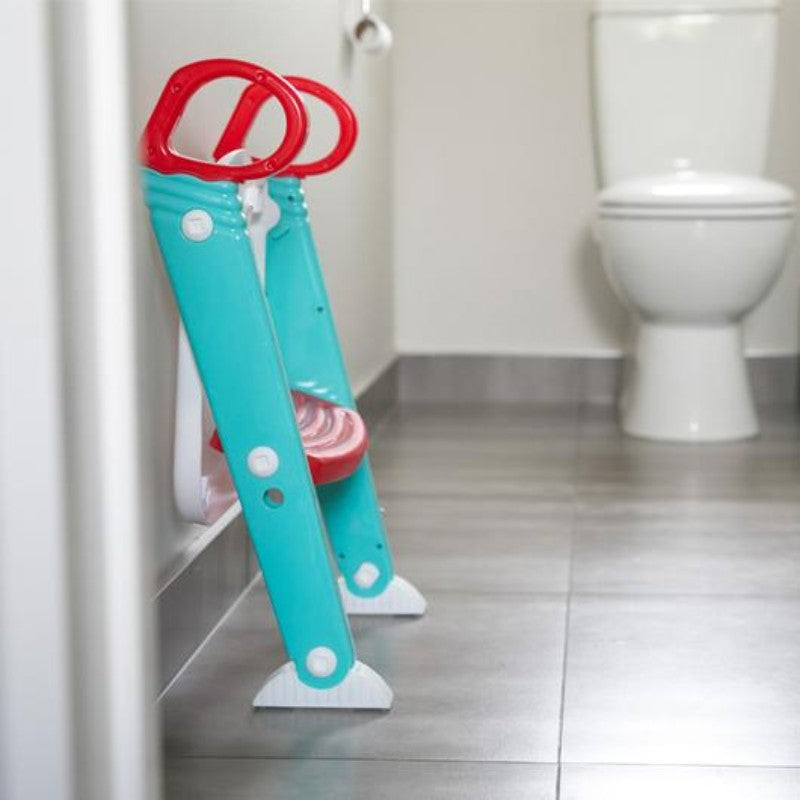 Moose Step on Up Toilet Trainer in grey and aqua, designed for toddler independence with non-slip pads and easy storage.