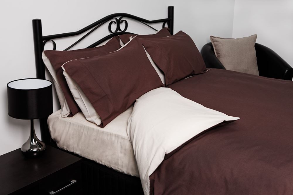 King-sized reversible duvet cover in maroon and white, soft blend fabric, includes two pillowcases, stylish and easy-care.