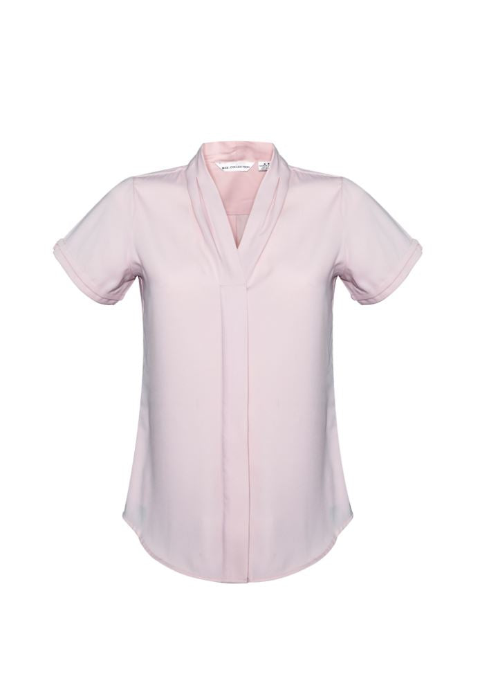 Blush pink short sleeve blouse in size 20, featuring secret button, action back pleat, and easy care fabric for professional wear.