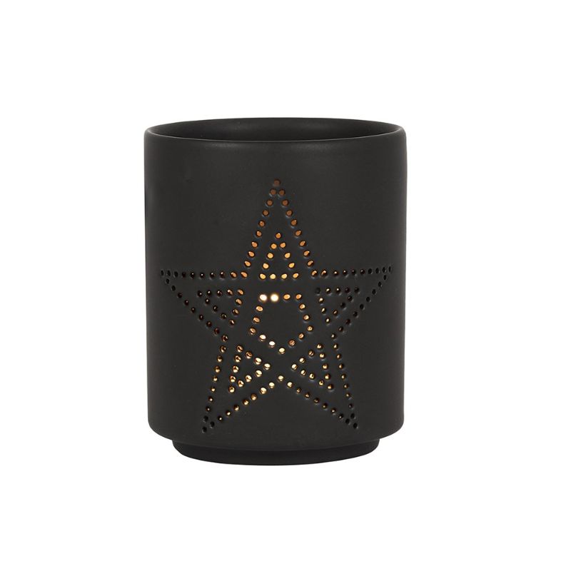 Small black ceramic tealight holder with pentagram cut-out, casting enchanting shadows and enhancing cozy atmospheres.