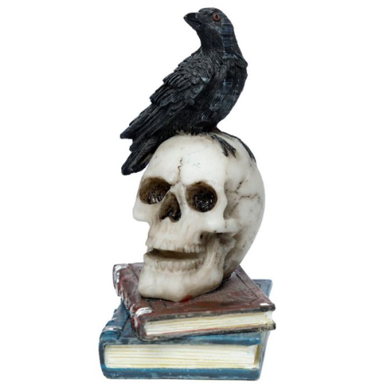 Crow figurine perched on a skull and books, adding gothic elegance to decor; made of durable resin, 10cm tall.