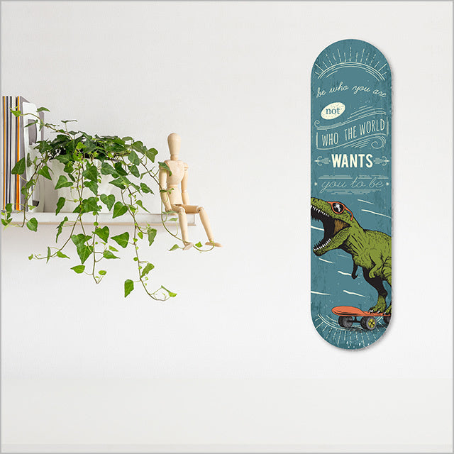 Skateboard-inspired wall art featuring a vibrant dinosaur design, perfect for indoor or outdoor decor, measuring 500mm x 130mm.