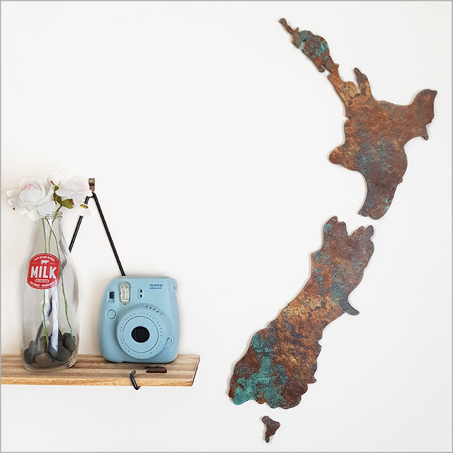 Small ACM NZ map wall art in copper patina pattern, showcasing New Zealand's landscapes and enhancing home decor.
