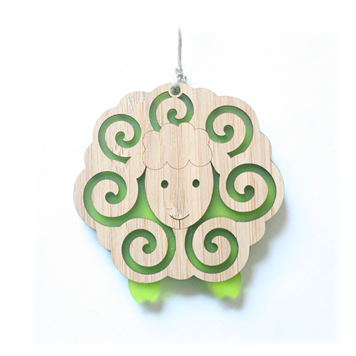 Whimsical lime sheep ornament made from bamboo and satin acrylic, perfect for holiday decor or thoughtful gifts.