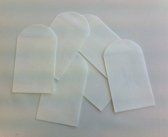Small white craft bags in a 6-pack, ideal for wedding favors, organization, and DIY projects, measuring 12.5 x 7cm.