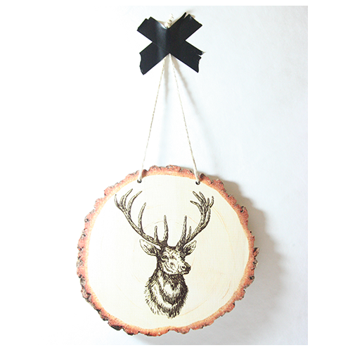 Rustic wood slice wall art featuring a majestic stag silhouette, crafted from eco-friendly pine veneer, ready to hang.