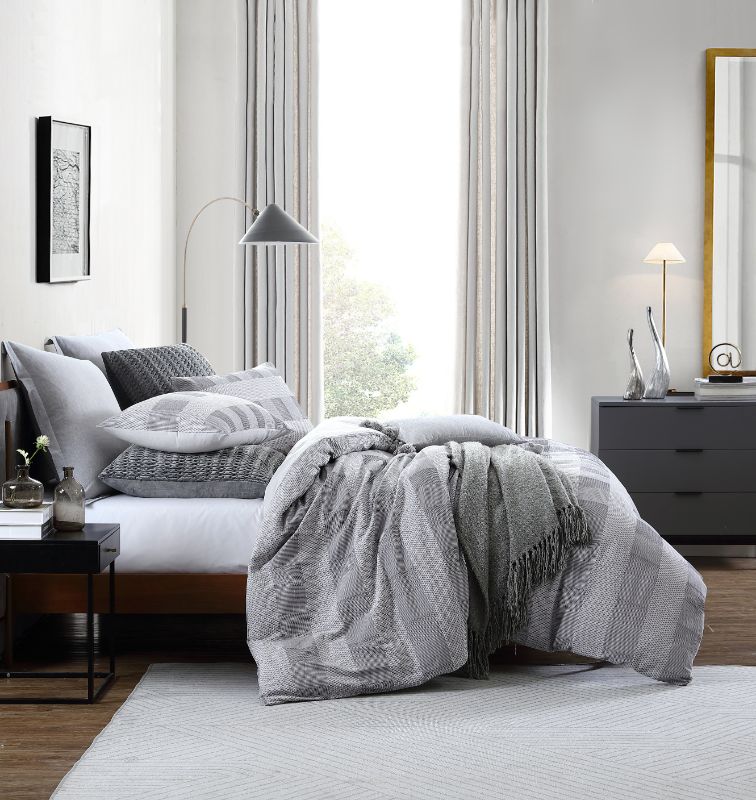 Queen duvet cover set in Subi Grey, featuring soft 100% cotton jacquard fabric and two matching pillowcases.