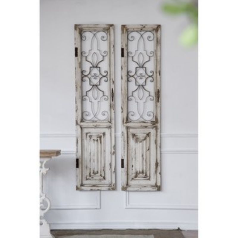 Elegant white decorative door with intricate metal grillwork, perfect for adding rustic charm to any interior space.