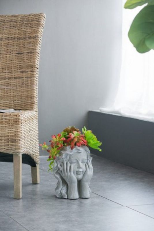 Charming 29cm Girl Statue planter, crafted from durable cement, perfect for adding whimsy to indoor or outdoor spaces.