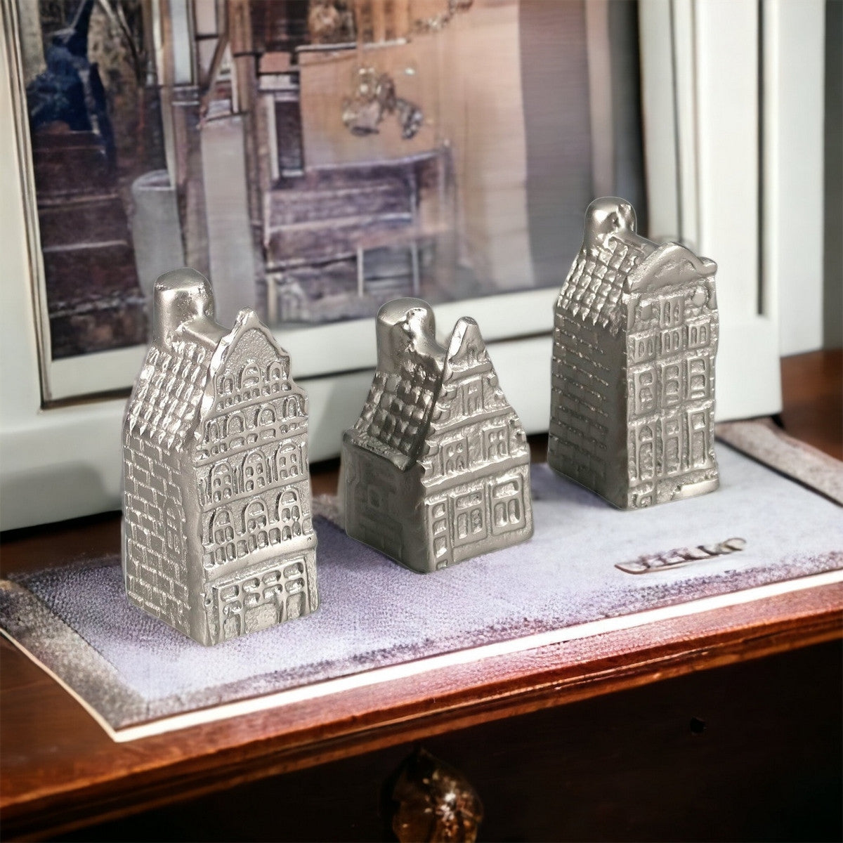 Elegant silver aluminium house sculpture, a stylish decorative piece for modern spaces, measuring 40x40x100 cm.