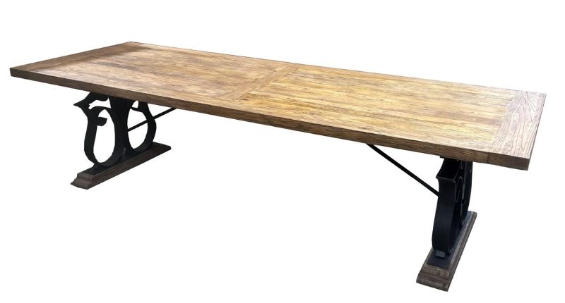 Reclaimed oak dining table with iron legs, spacious for 8 diners, featuring rustic elegance and sustainable design.