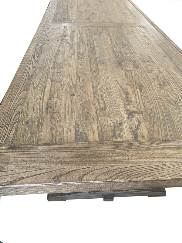 Reclaimed elm dining table with white double pedestal base, showcasing natural wood grain for a rustic-modern dining experience.