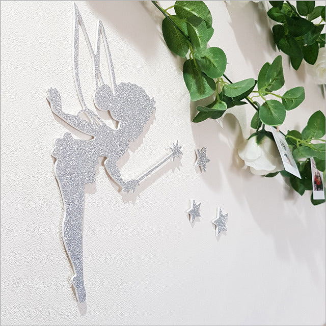 Glittery Tinkerbell wall art with stars, perfect for nursery or bedroom decor, measuring 18cm x 28.5cm.