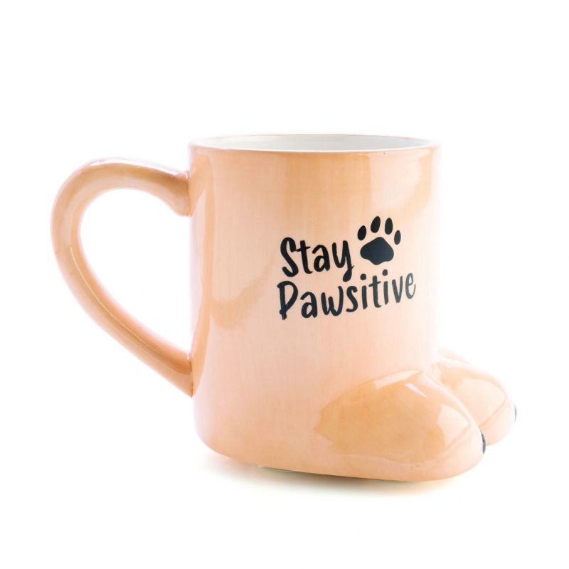 3D beige mug shaped like a dog's paw with "Stay Pawsitive" message, perfect for dog lovers and hand wash only.