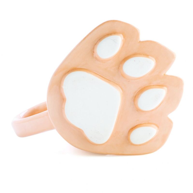 3D beige mug shaped like a dog's paw with the phrase 'Stay Pawsitive', perfect for dog lovers and unique gifting.