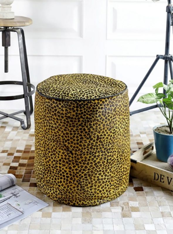 Round leather ottoman in leopard print, 46cm, offering stylish seating and comfort for any modern or bohemian decor.
