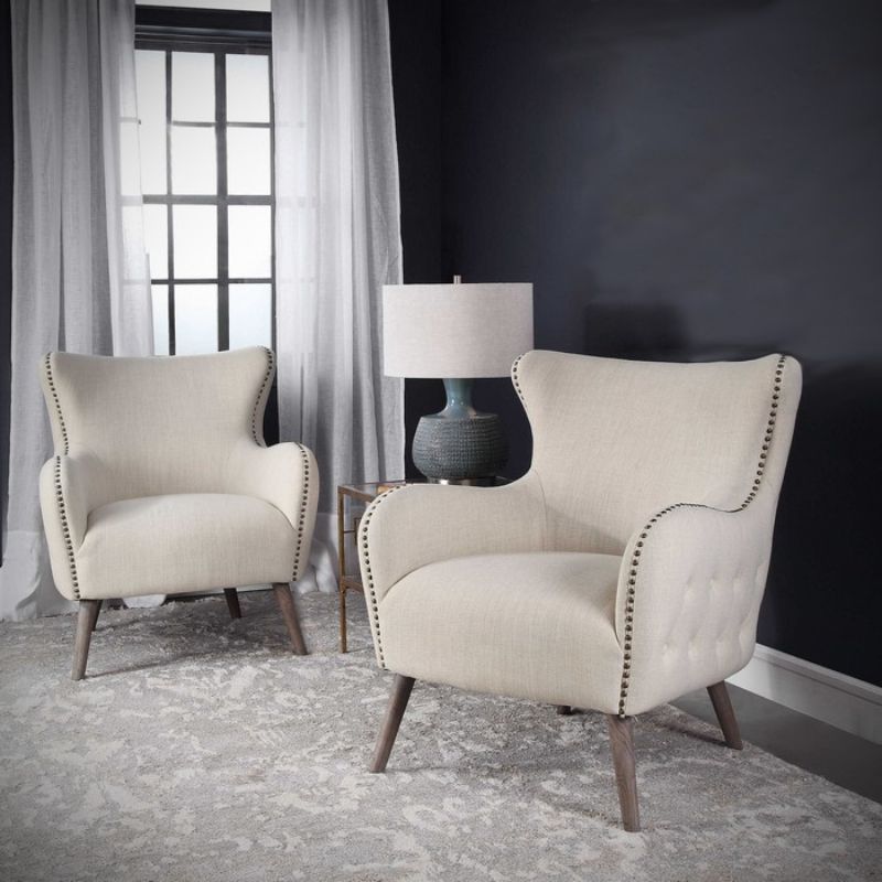 Elegant Sahara occasional chair in soft linen fabric with brass nail detailing, perfect for modern and classic living spaces.