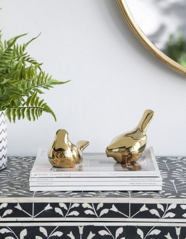 Set of 2 elegant gold bird ornaments, perfect for enhancing any home decor with a touch of sophistication.