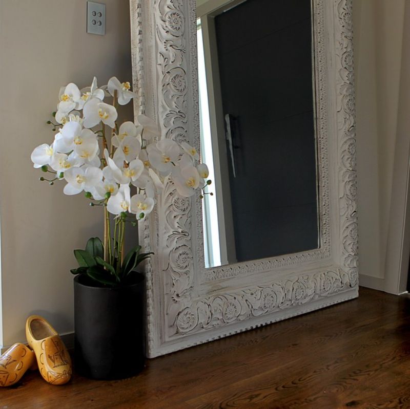 Lifelike artificial white orchid in a tall black pot, 105cm, perfect for elegant home decor with zero maintenance.