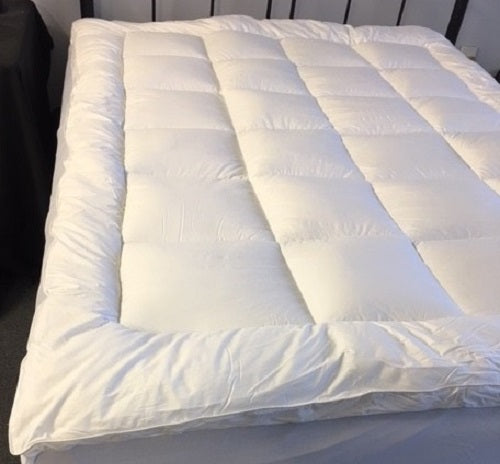 Luxurious single mattress topper with 75/25 goose down and feather fill for enhanced comfort and restful sleep.