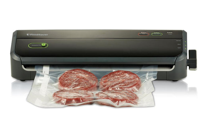 Innovative Foodsaver Lock and Seal by Sunbeam with one-handed locking arm, removable drip tray, and accessory port for easy food preservation.