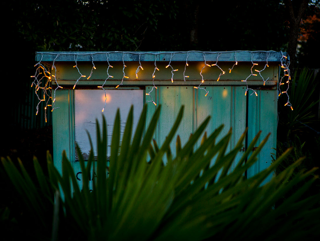Warm white icicle fairy lights on a durable white cable, 3m long, perfect for indoor/outdoor festive decor.