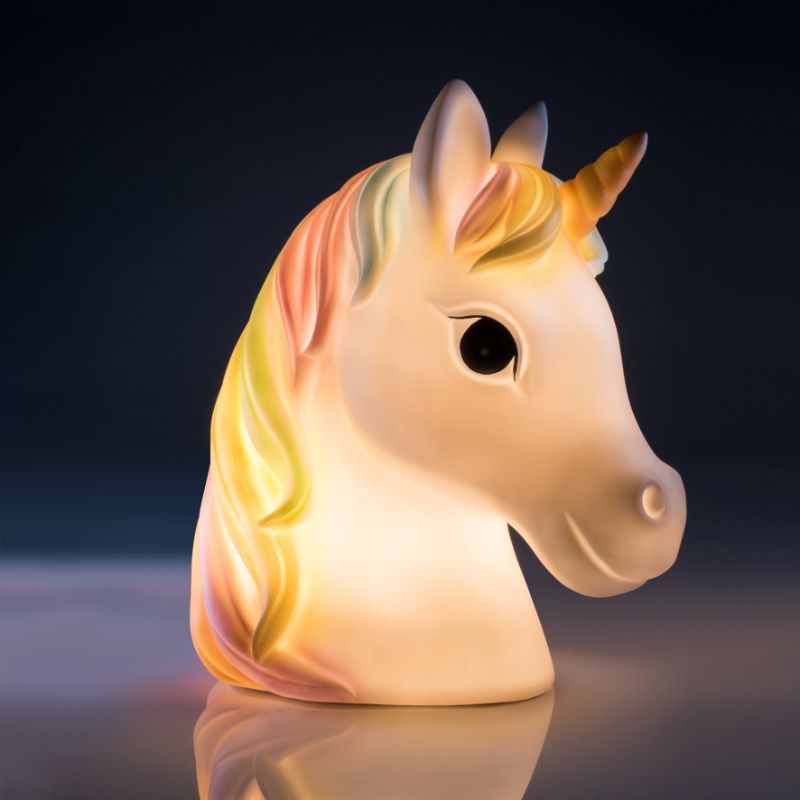 LED table lamp featuring a white unicorn with a rainbow mane, perfect for creating a magical ambiance in kids' rooms.