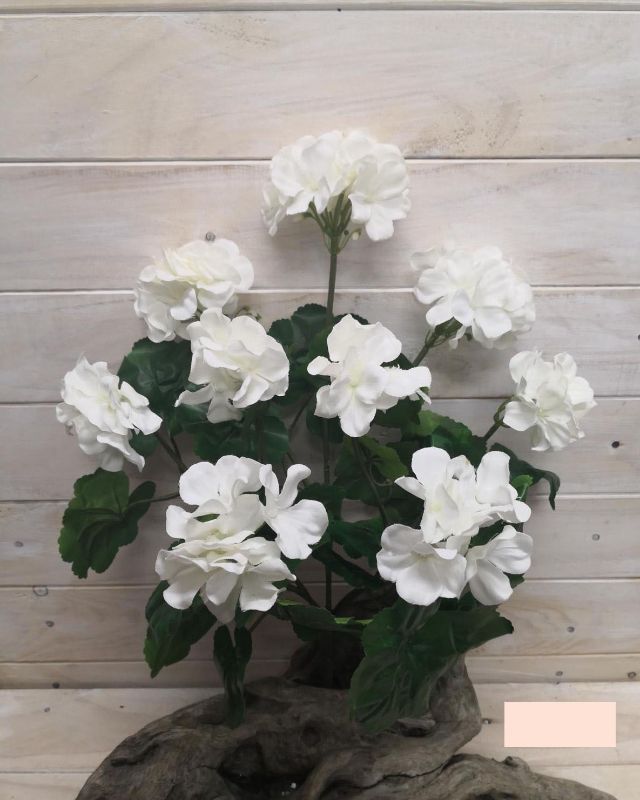Lifelike large white artificial geranium bush with vibrant green leaves, perfect for indoor or outdoor decor.