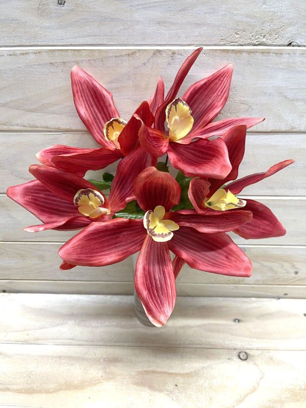 Burgundy artificial cymbidium orchid bush with realistic blooms, perfect for enhancing decor without maintenance.