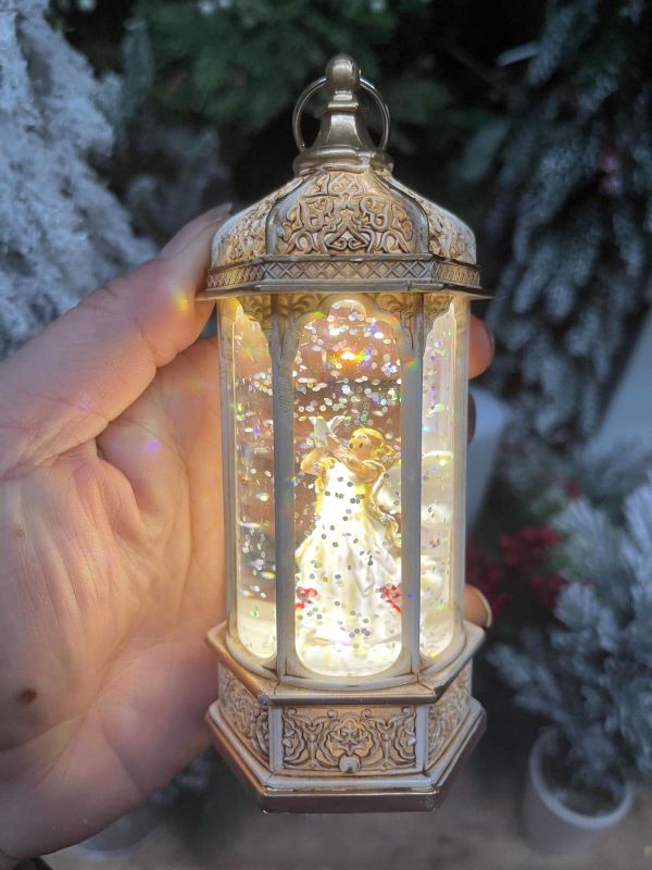 Elegant 14cm angel lamp providing soft, warm light, perfect for nurseries or serene home decor.