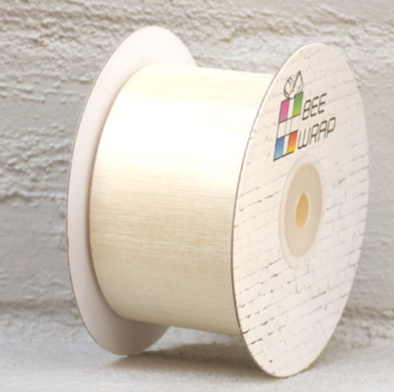 Elegant ivory organza ribbon, 50mm wide, 50m long, perfect for weddings, gift wrapping, and crafting projects.