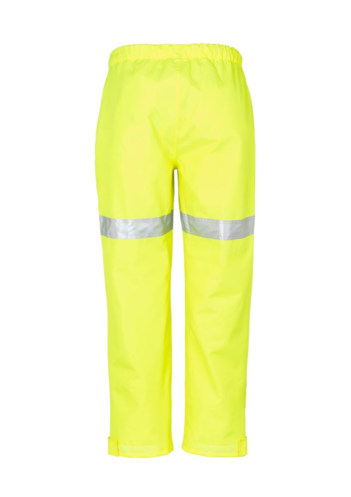 Bright yellow waterproof Mens Taped Storm Pants by Syzmik, featuring an elastic waist and reflective tape for visibility.