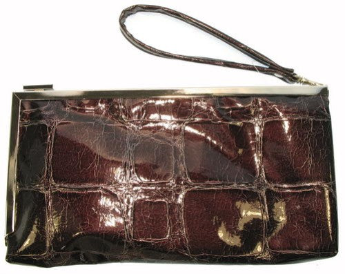 Chic black evening bag with a sleek silhouette, detachable chain strap, and spacious interior for essentials.