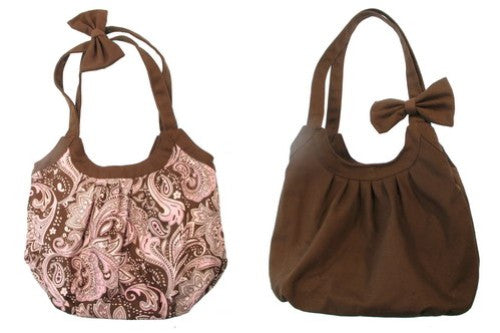 Stylish pink reversible bag with paisley pattern, perfect for any occasion, roomy, and durable for everyday use.