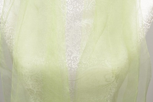 Vibrant lime silk wrap scarf with chic tassels, perfect for elevating any outfit and versatile for all occasions.