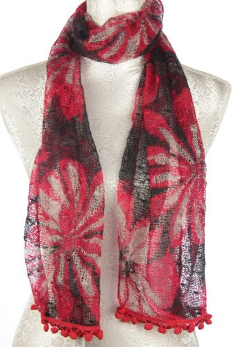 Vibrant red polyester scarf with playful pompoms, elegantly draping at 38 x 160 cm for stylish warmth and comfort.